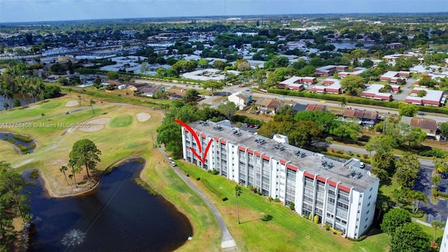 bird's eye view with a water view and golf course view