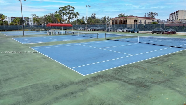 view of sport court featuring fence