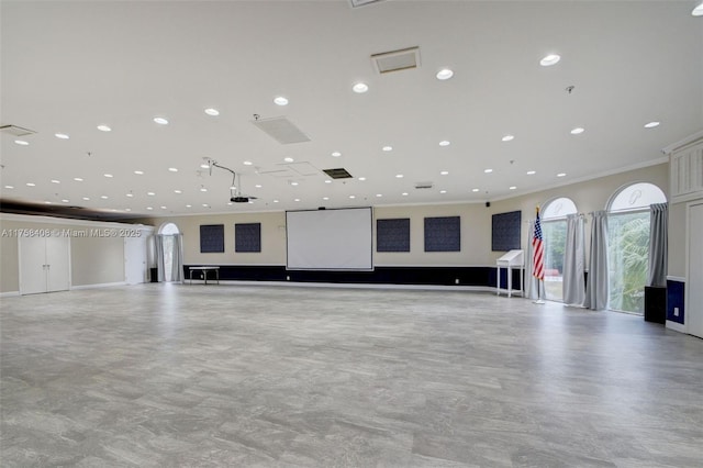 interior space featuring recessed lighting, visible vents, and ornamental molding