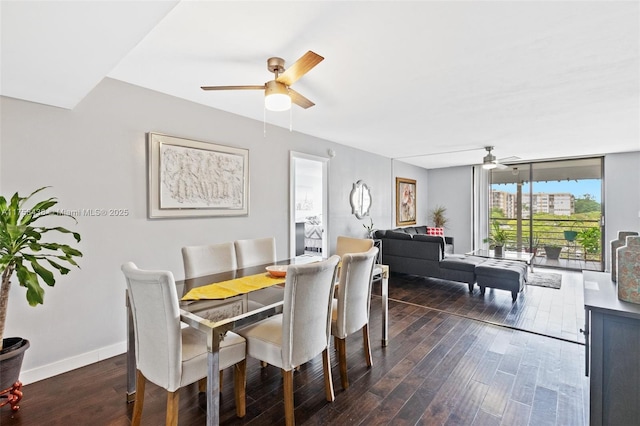 dining area with dark wood-style floors, ceiling fan, floor to ceiling windows, and baseboards