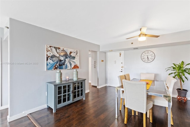 dining area with a ceiling fan, baseboards, and wood finished floors