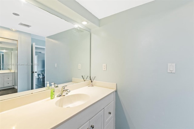 bathroom featuring vanity and visible vents