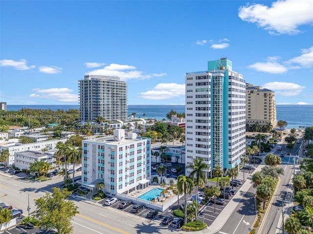 drone / aerial view featuring a water view and a city view