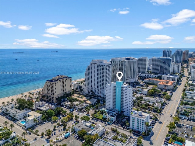 birds eye view of property with a water view and a city view