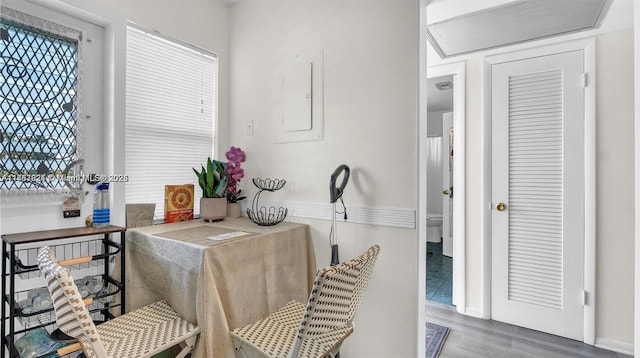 interior space featuring wood finished floors and electric panel