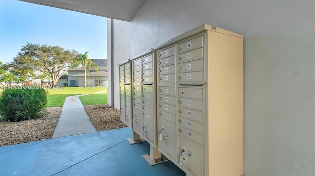 view of property's community with a yard and mail area