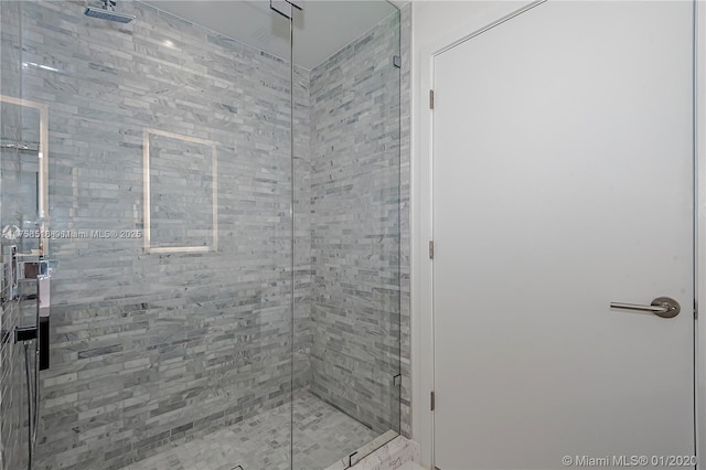 bathroom with a shower stall