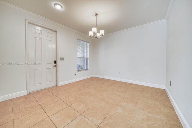 unfurnished room with a notable chandelier, crown molding, and baseboards