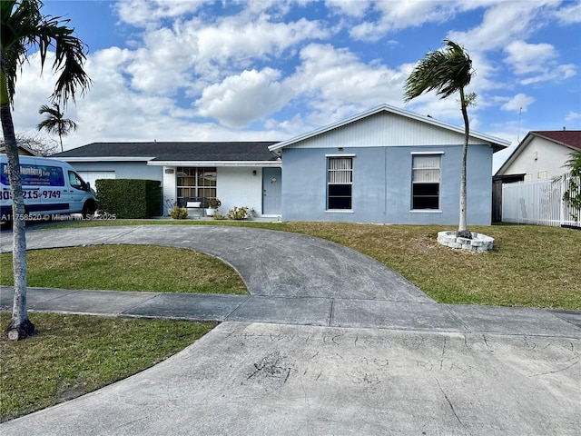 single story home featuring driveway, fence, a front lawn, and stucco siding