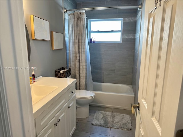 full bathroom with tile patterned floors, vanity, toilet, and shower / bathtub combination with curtain