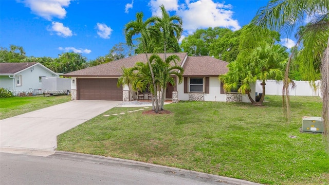 single story home with stone siding, a front lawn, an attached garage, and fence