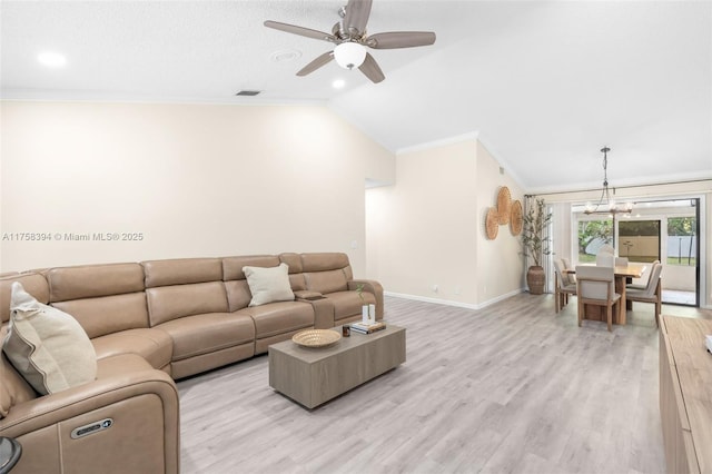 living area featuring crown molding, lofted ceiling, visible vents, light wood-style floors, and baseboards