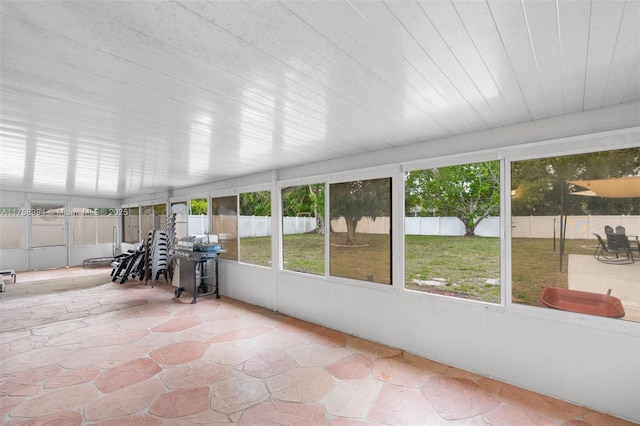 sunroom with wood ceiling and plenty of natural light