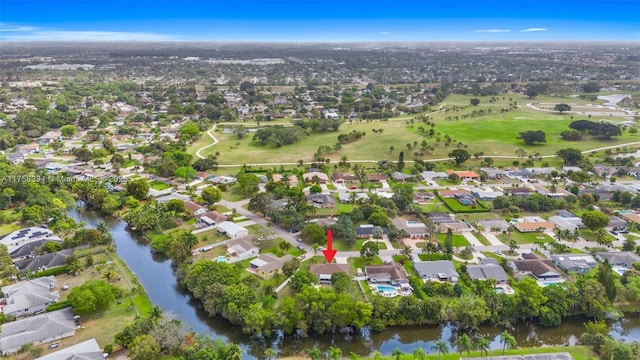 drone / aerial view featuring a water view and a residential view