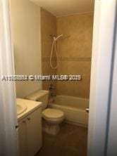 full bathroom with vanity, shower / bathing tub combination, and toilet