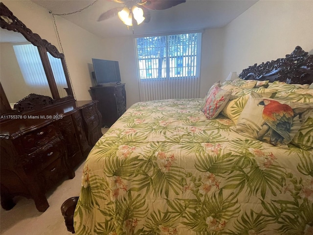 bedroom with light colored carpet and ceiling fan