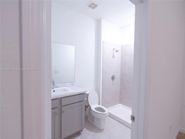 full bathroom with visible vents, toilet, tile patterned flooring, vanity, and a shower stall