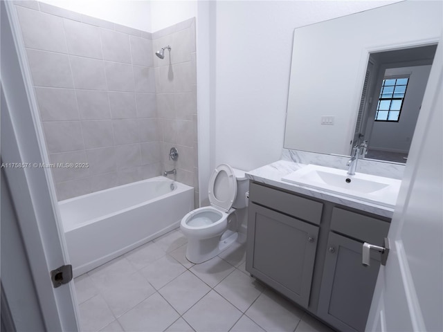 bathroom featuring shower / washtub combination, vanity, toilet, and tile patterned floors