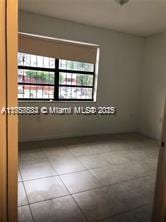 empty room with tile patterned floors