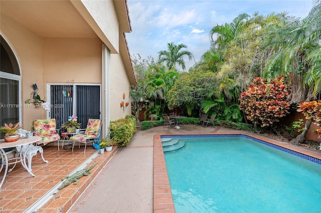 pool with a patio