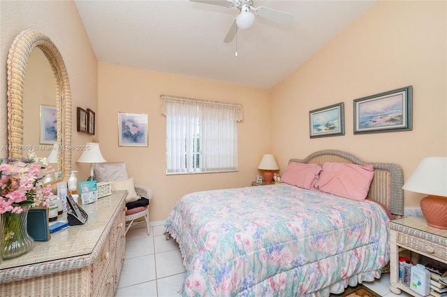 bedroom with lofted ceiling, light tile patterned flooring, and ceiling fan