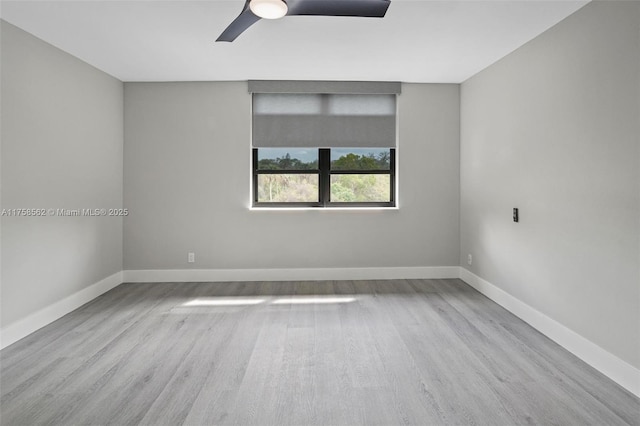 unfurnished room featuring ceiling fan, baseboards, and wood finished floors