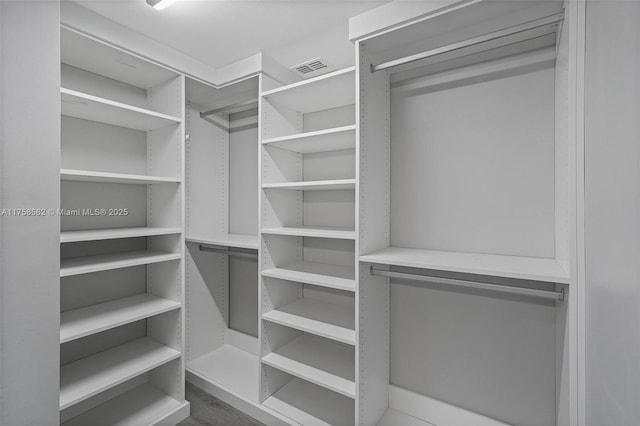 walk in closet with visible vents