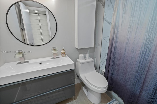 full bathroom featuring vanity and toilet