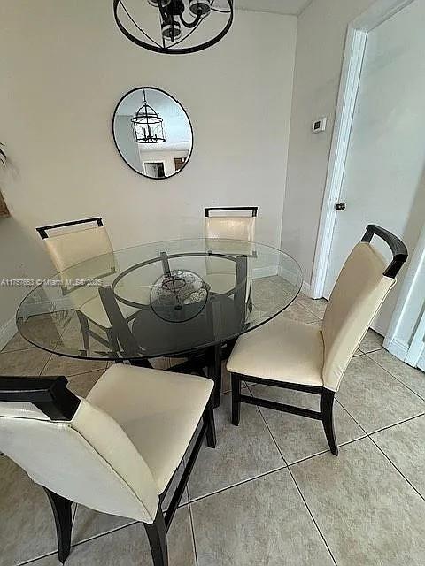 tiled dining space with baseboards