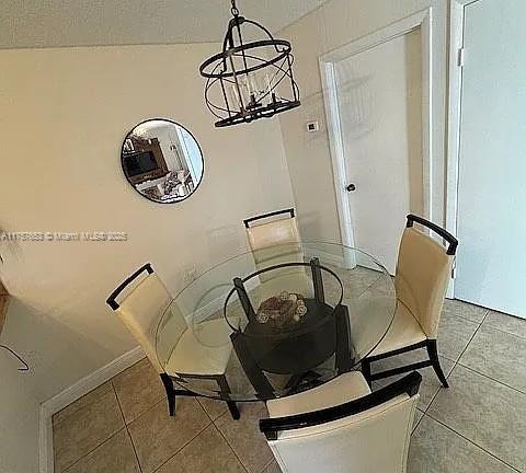 dining space featuring tile patterned flooring