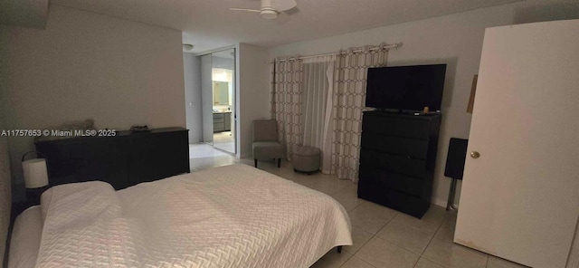 bedroom featuring light tile patterned floors and a ceiling fan