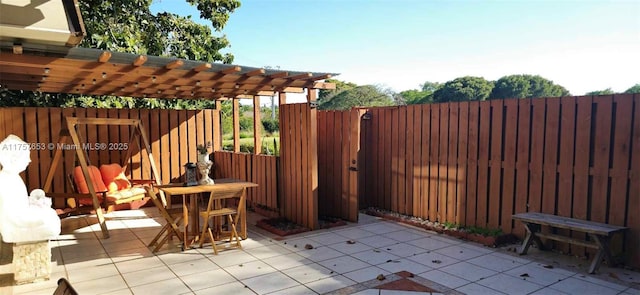 view of patio featuring fence and a pergola