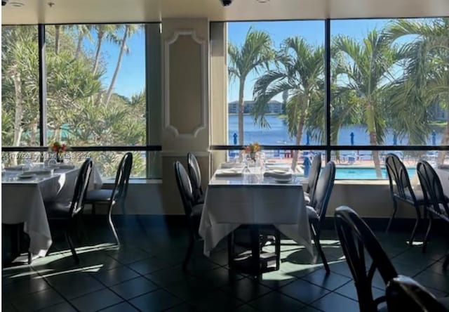 dining room featuring a water view