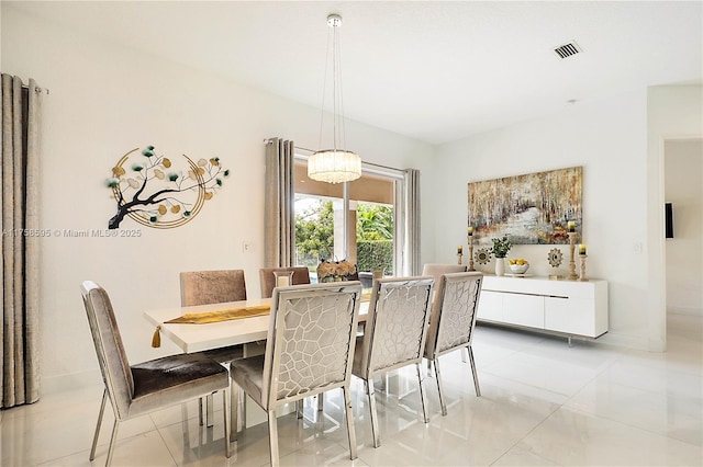 dining area with visible vents, baseboards, and light tile patterned floors