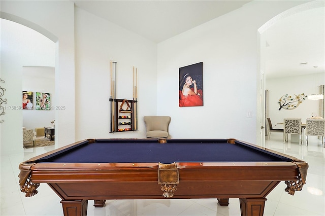 game room with billiards and arched walkways