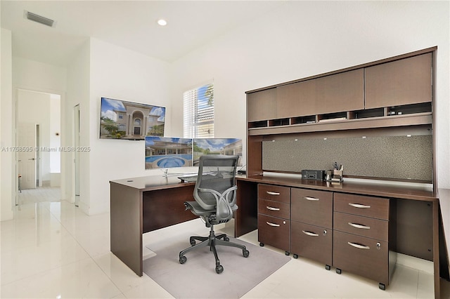 office with light tile patterned floors and visible vents