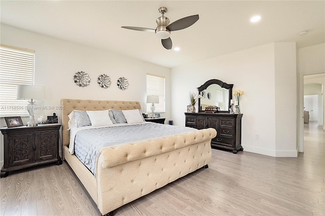 bedroom with recessed lighting, multiple windows, light wood-type flooring, and baseboards