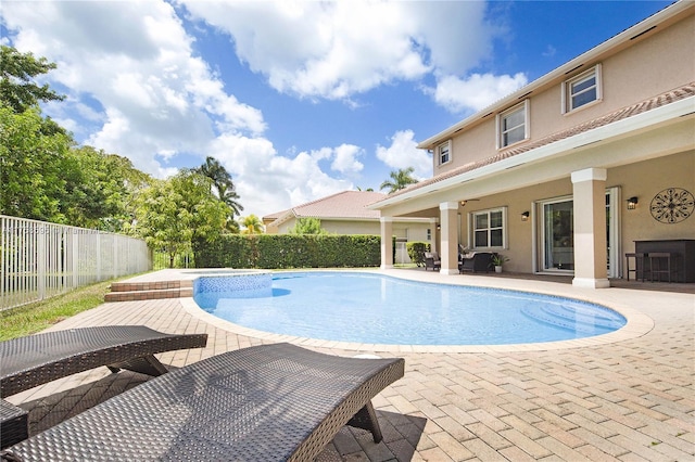 view of pool featuring a patio area, a fenced backyard, and a fenced in pool