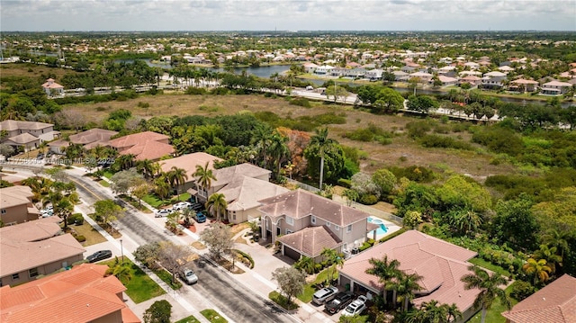 aerial view featuring a water view and a residential view