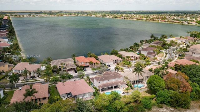 aerial view with a water view and a residential view