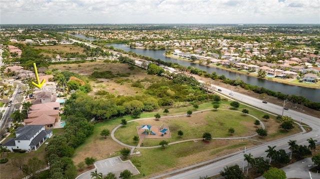 aerial view with a residential view and a water view