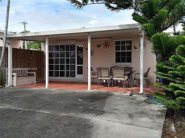 view of patio / terrace featuring outdoor dining area and fence