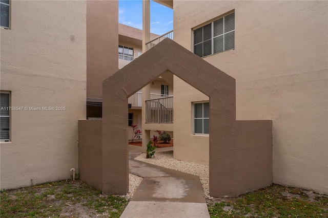 property entrance featuring stucco siding