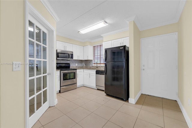 kitchen with stainless steel appliances, white cabinetry, crown molding, and tasteful backsplash