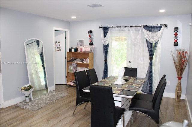 dining area with recessed lighting, visible vents, baseboards, and wood finished floors