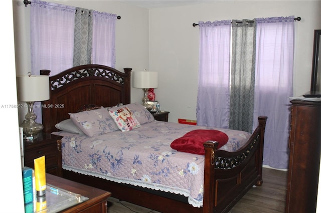 bedroom with wood finished floors
