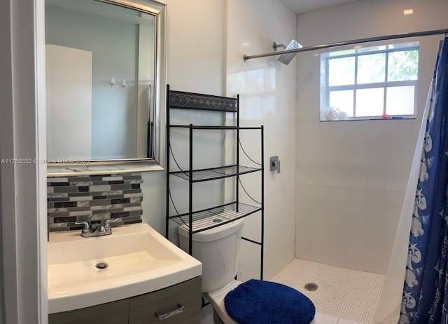 bathroom featuring toilet, tasteful backsplash, tiled shower, and vanity