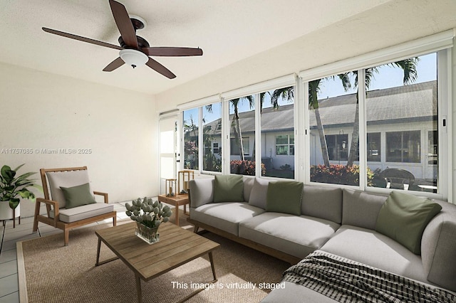 sunroom / solarium featuring plenty of natural light and ceiling fan