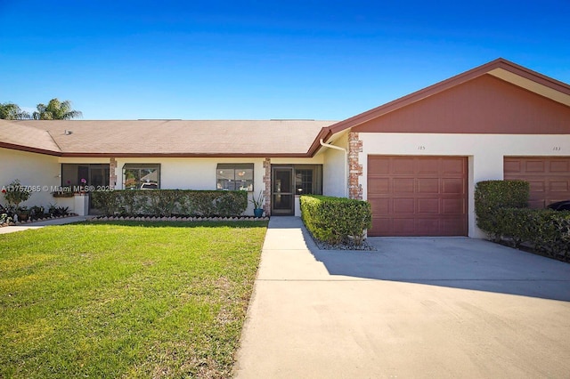 single story home featuring stucco siding, concrete driveway, a garage, stone siding, and a front lawn