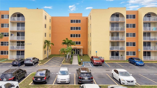 view of property featuring uncovered parking